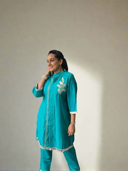 Radiant embroidered kurti with pants.