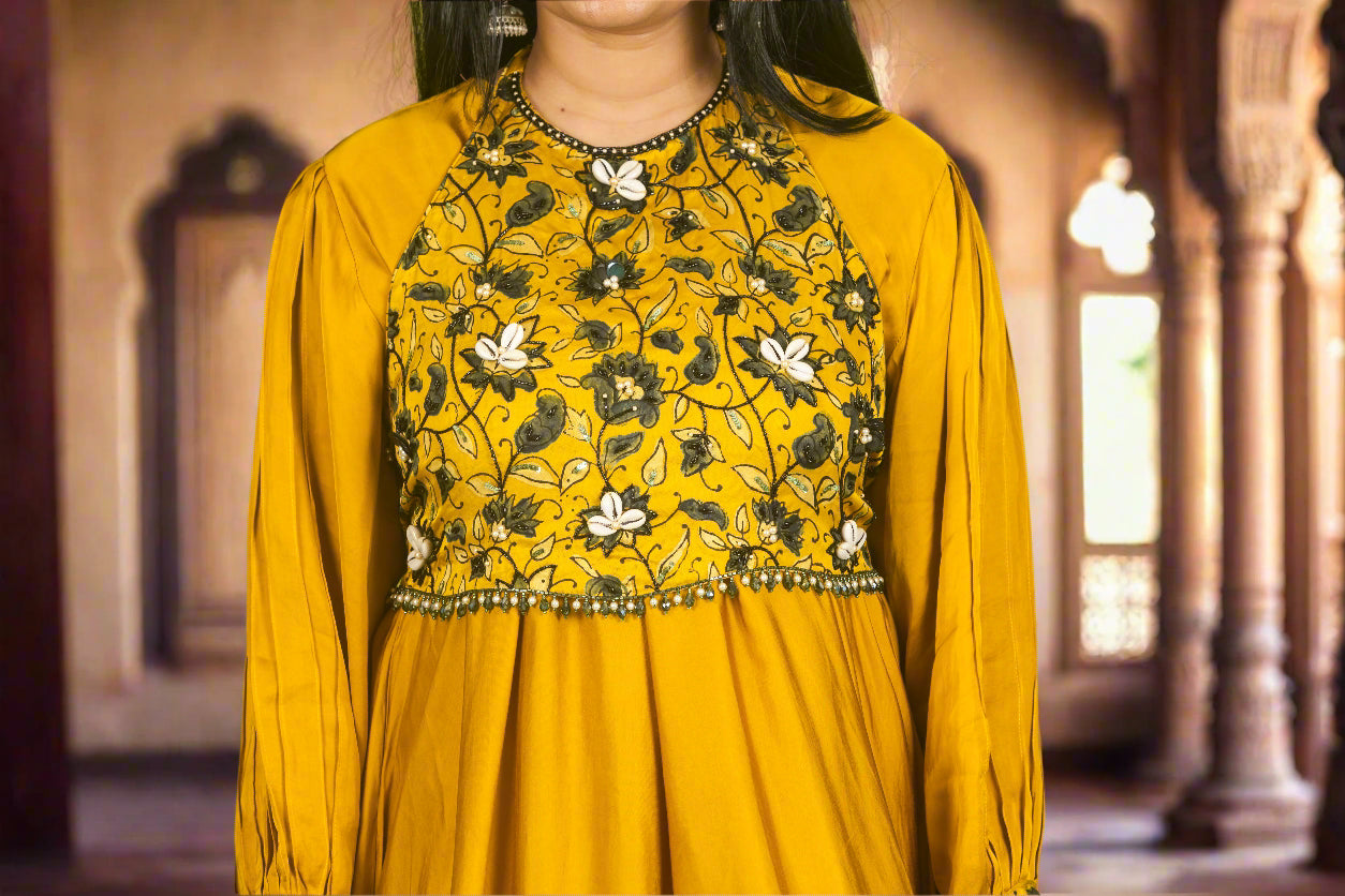 Yellow ajrakh kodi luxe kurti with hand embroidered blouse.
