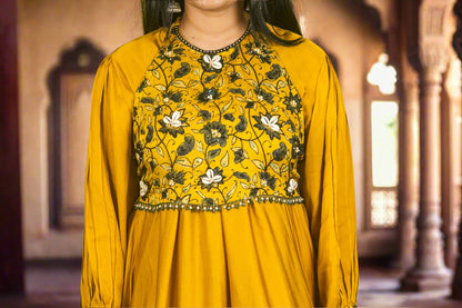 Yellow ajrakh kodi luxe kurti with hand embroidered blouse.